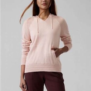 Athleta Evergreen sweater hoodie in light pink.